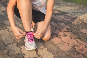 runner tying her shoes